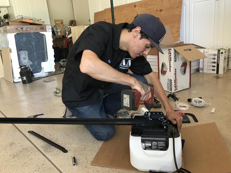 Alex's son assembling a new LiftMaster garage door opener