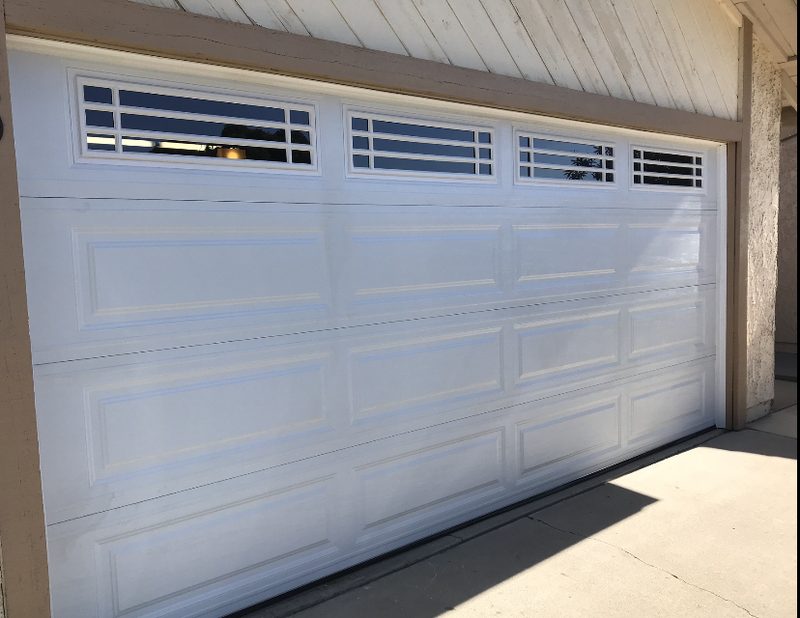 White long panel, grid windows garage door installed by AA Garage Doors