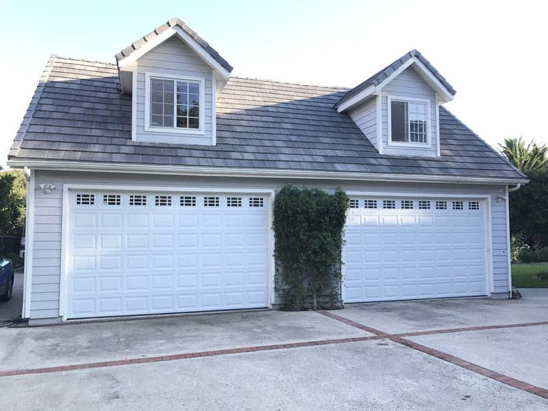 White doors with window tops, two-door garage garage door installed by AA Garage Doors