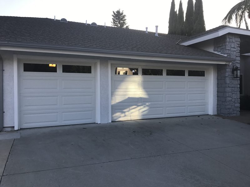 White raised panel, two-door garage garage door installed by AA Garage Doors