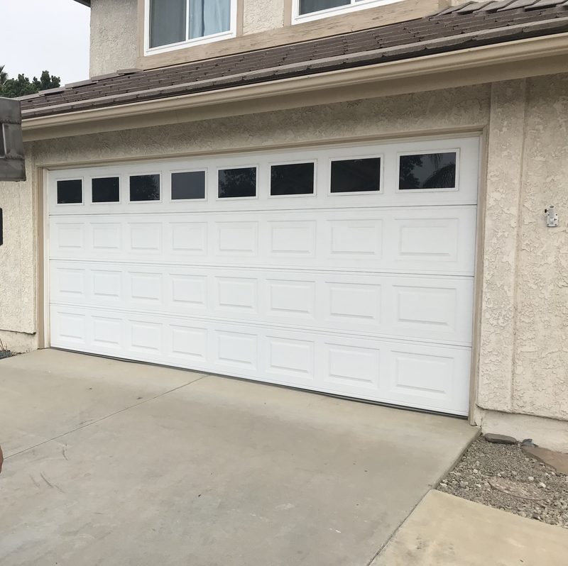 White long panel, window tops garage door installed by AA Garage Doors