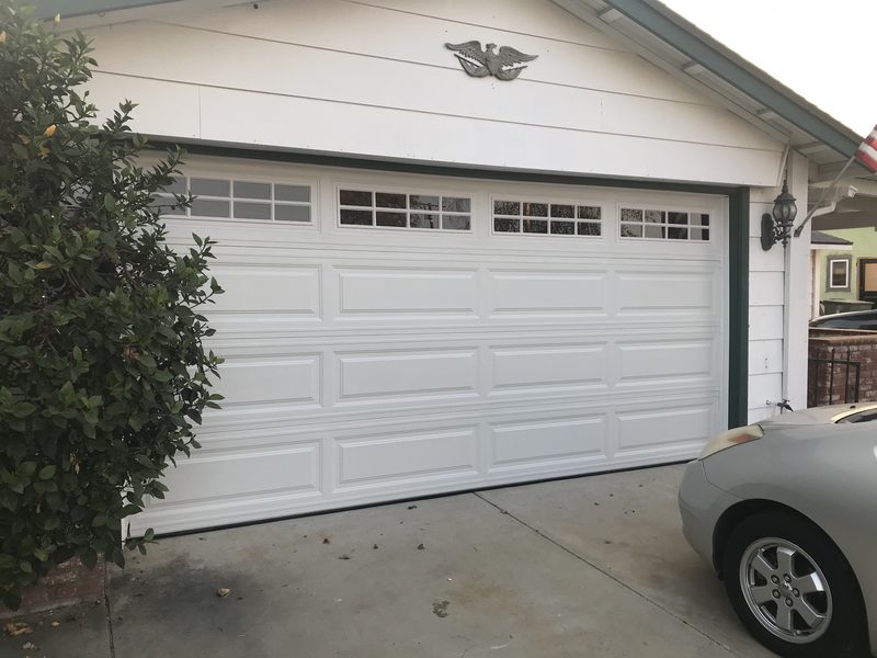 White long panel, window tops garage door installed by AA Garage Doors