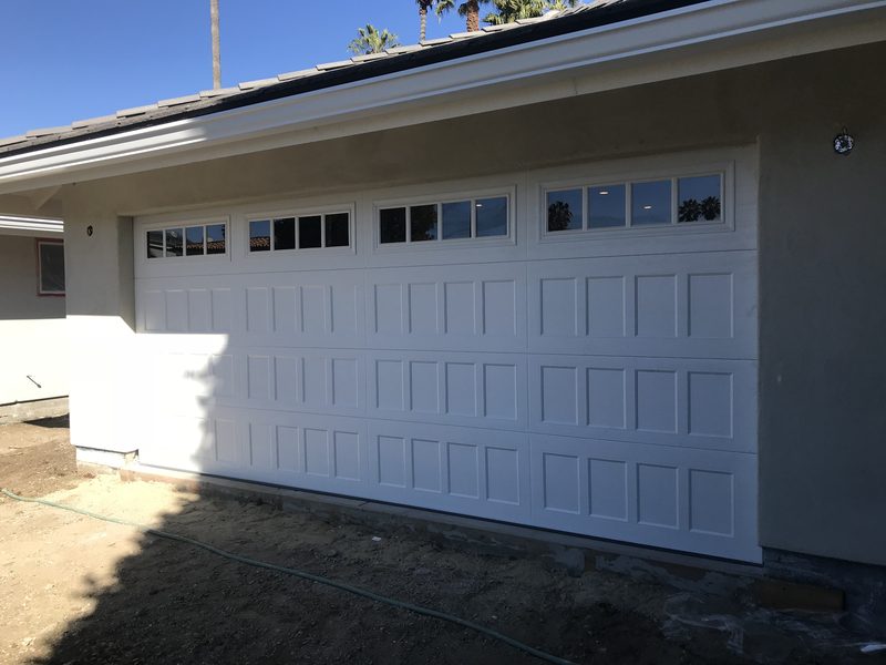 White raised panel, short windows garage door installed by AA Garage Doors